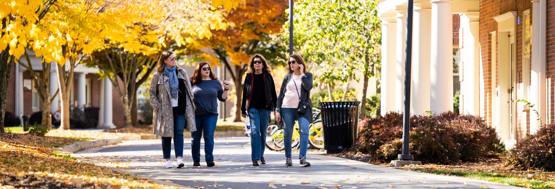 people walking on campus in the fall