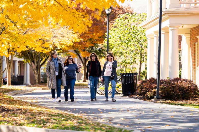 people walking on campus in the fall