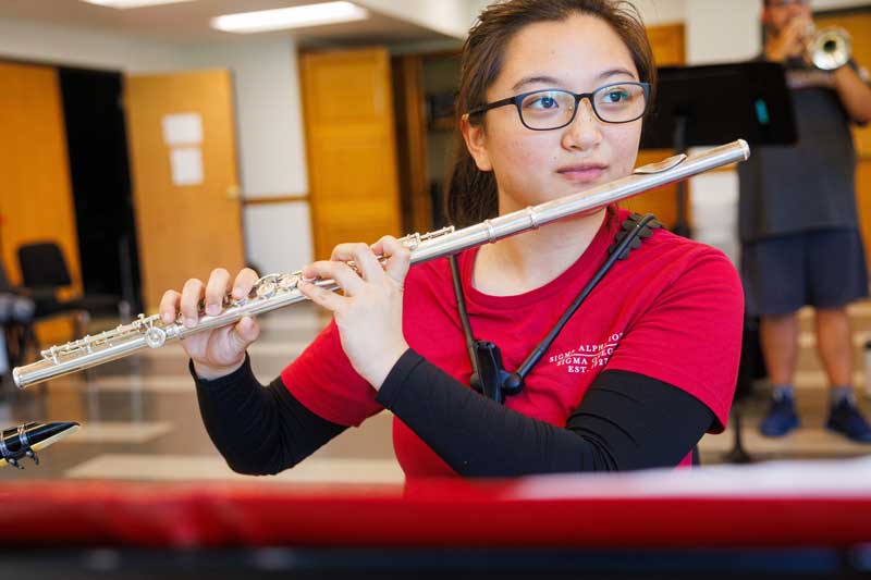 student playing a musical instrument
